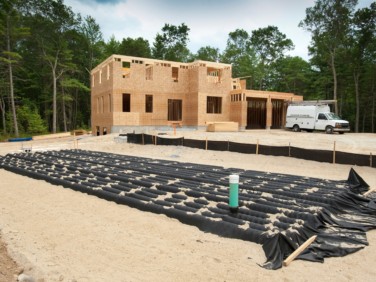 leach field installation in front yard of brand new house being built